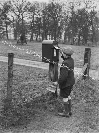 BOY AT LETTERBOX